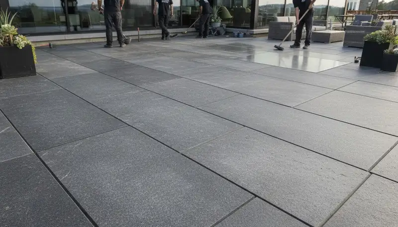 Modern large stone slab patio installation by landscaping experts in Madison, WI